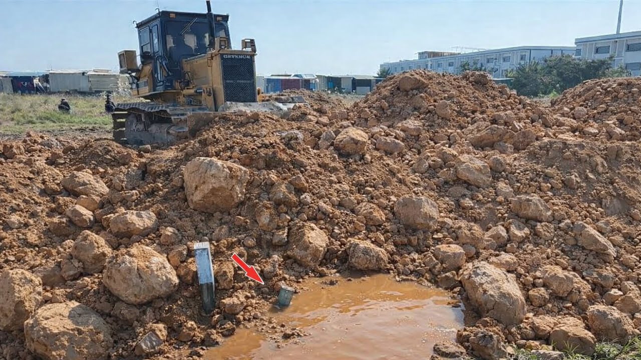 Extremely Powerful D31P Dozer Pushing Soil & Rocks Loading Dump Trucks
