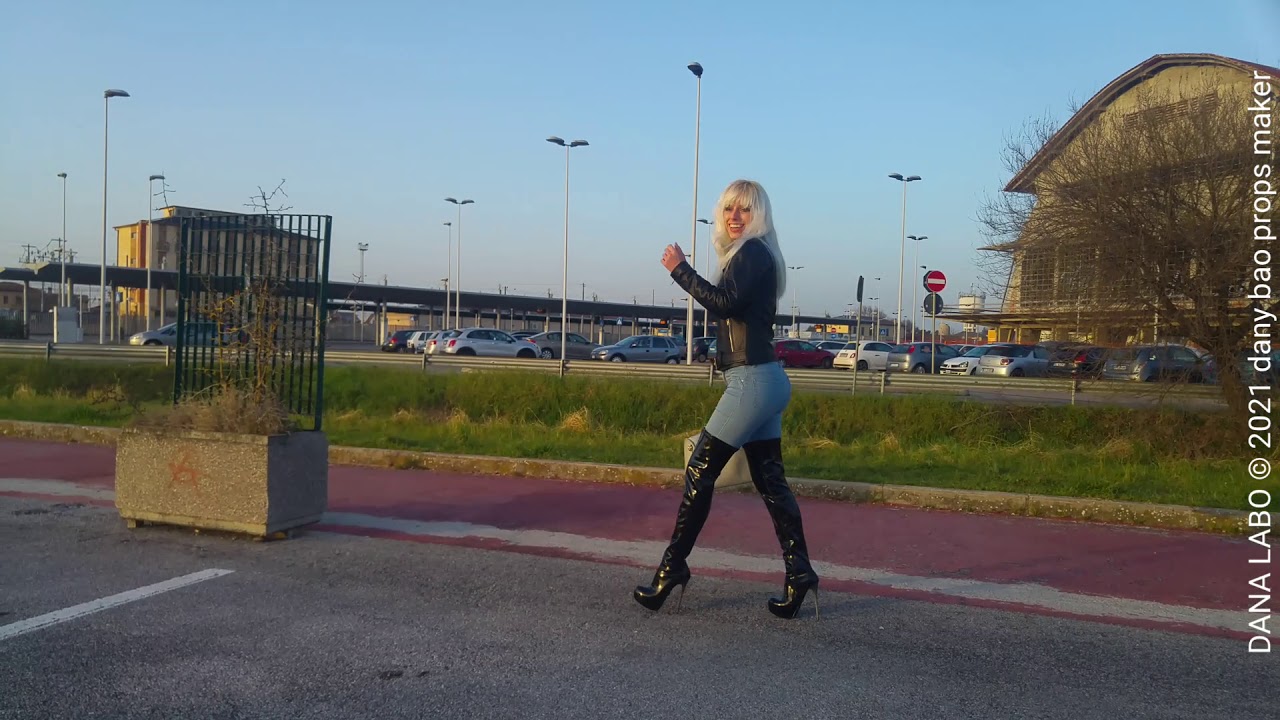 DANA LABO - MY BLONDE WIFE IN SPRING CLOTHING, WALK SHINY BOOTS OVER KNEE, LEATHER JACKET AND JEANS