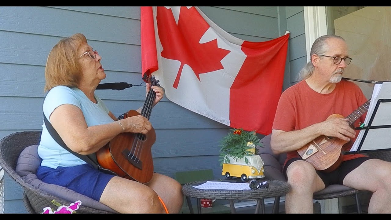Play music on the porch day 2025 - Bev and Mark play Toto's Georgy Porgy.