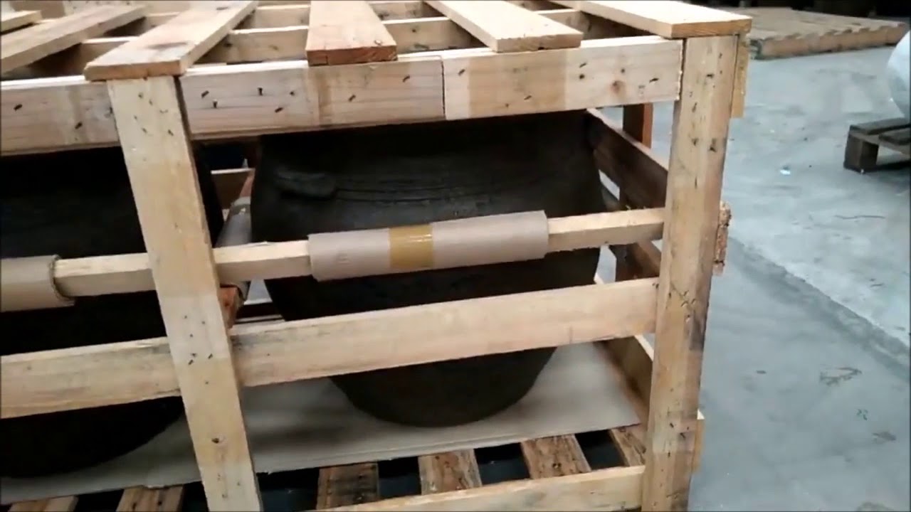 Chiang Mai Packing & Shipping Agent Demonstrates Crating Process of Terracotta Pottery