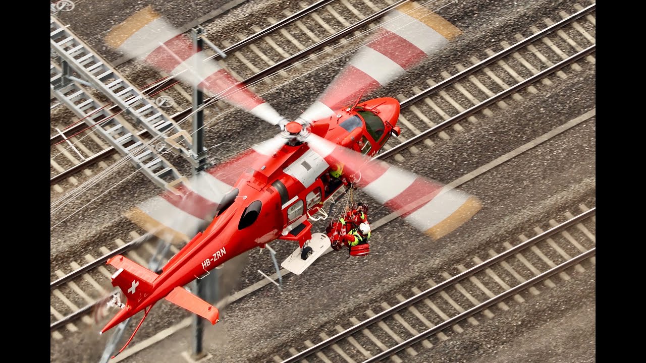 Look down on rescue helicopter hoist training Rega Leonardo AW109 Da Vinci in action