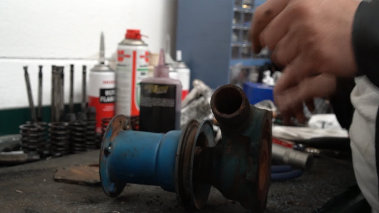 Rebuilding a water pump on a Ford Tractor