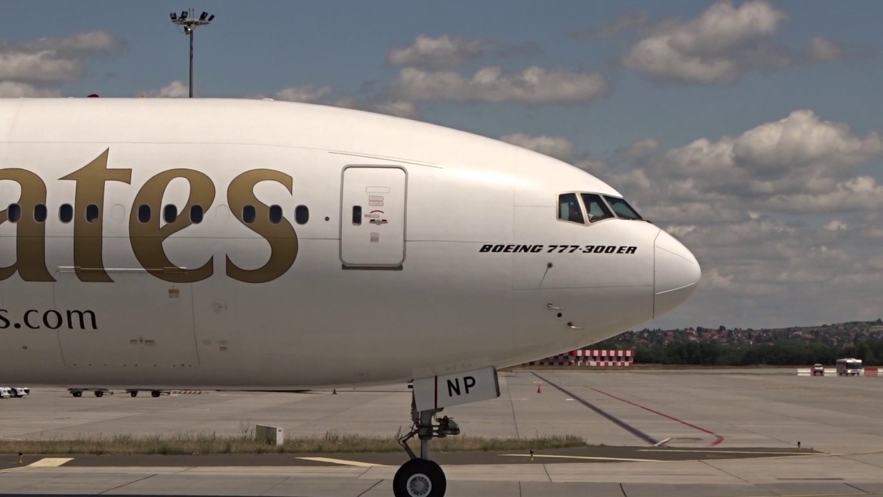 CLOSE-UP Emirates Boeing 777-300ER with Wawing First Officer at Budapest Airport