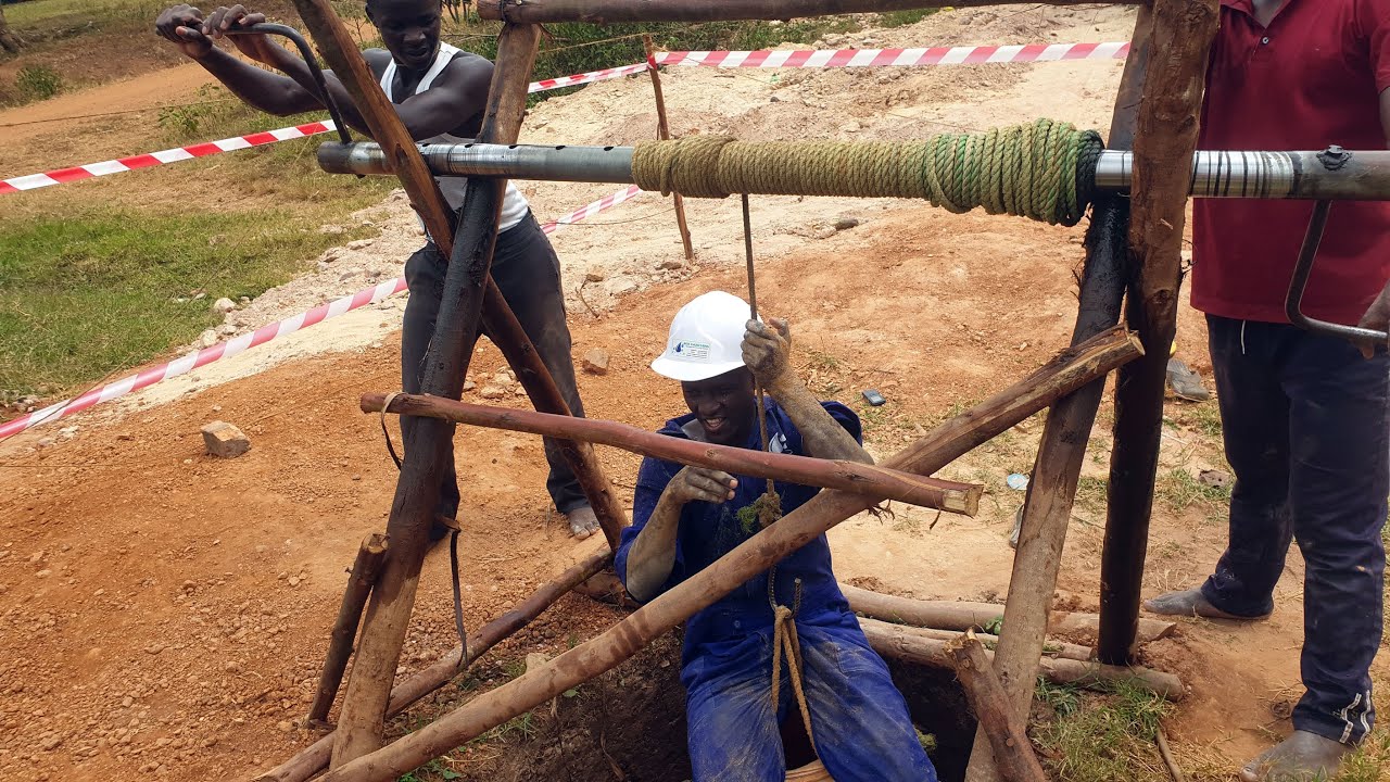 How to dig a shallow water well using manual labor - Digging a hand dug water well