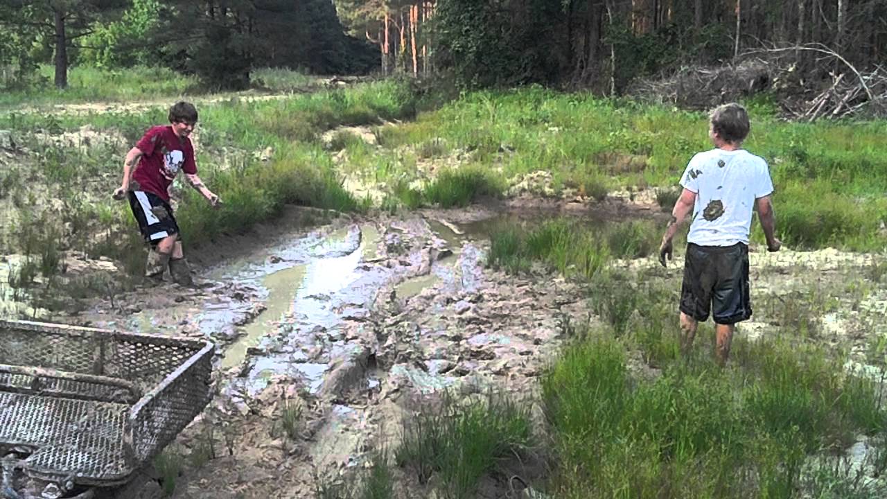 Boys playing in the mud