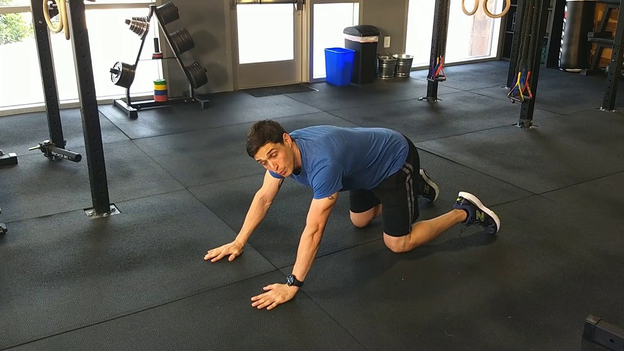 Push-up with alternating arm reach