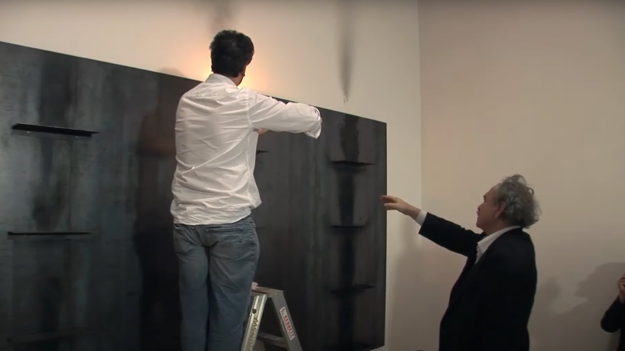 Artist Jannis Kounellis installing 'Untitled 1984/87' (1987)