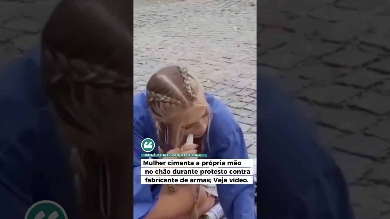 🇩🇪Uma ativista ambiental decidiu colar m&atilde;o na cal&ccedil;ada durante protesto contra mudan&ccedil;as clim&aacute;ticas.