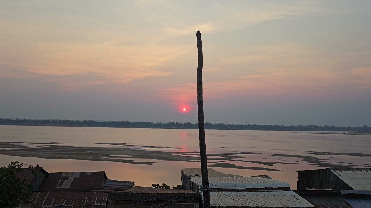 Sunset on the Mekong River with ambient street music (Vietnamese New Year) in Kratie, Cambodia