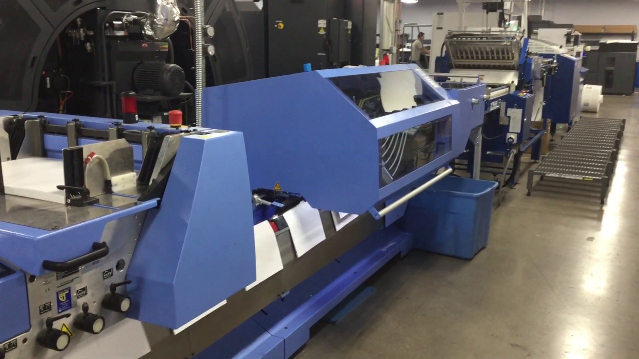 Roll Fed MBO SVC Sheeter and DFT Folder System feeding a Muller Martini Presto II Digital Stitcher