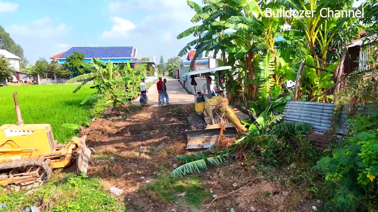 Perfectly Clean Project Landfill On Water Making Road Village by Bulldozer D20P With Truck