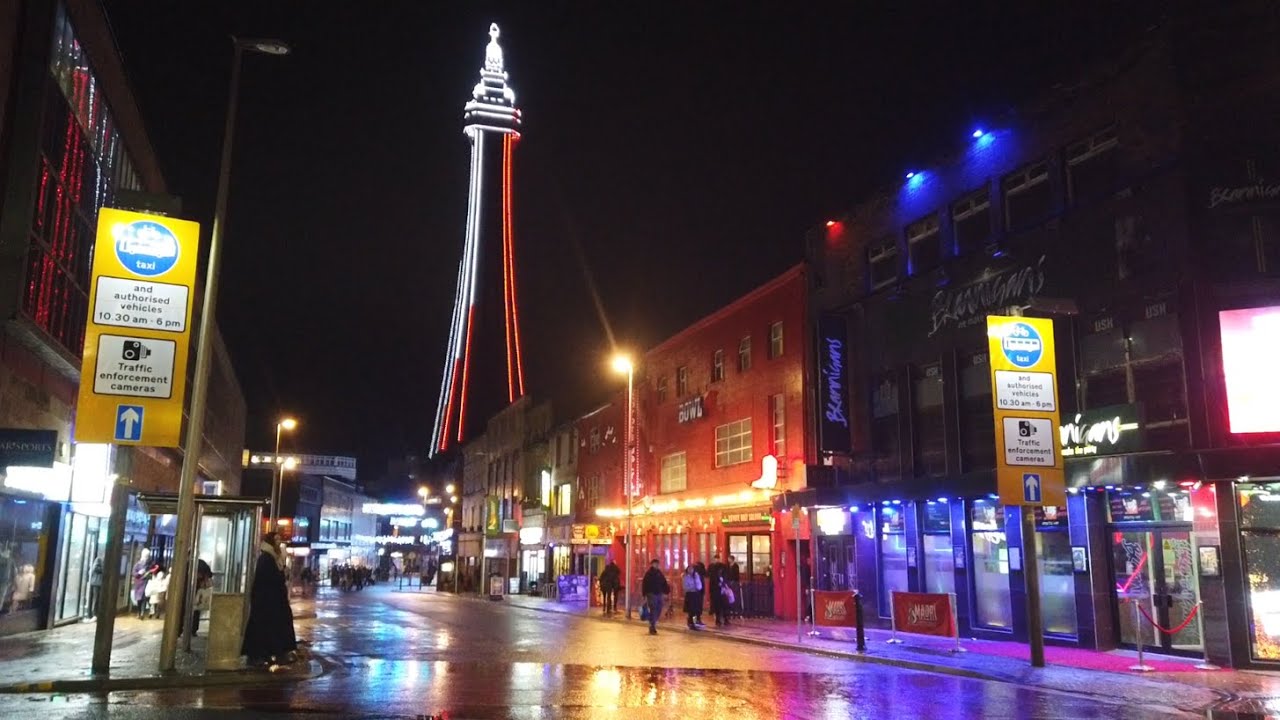 BLACKPOOL christmas by the sea, wet and windy blackpool, but  promenade is packed, & restaurants