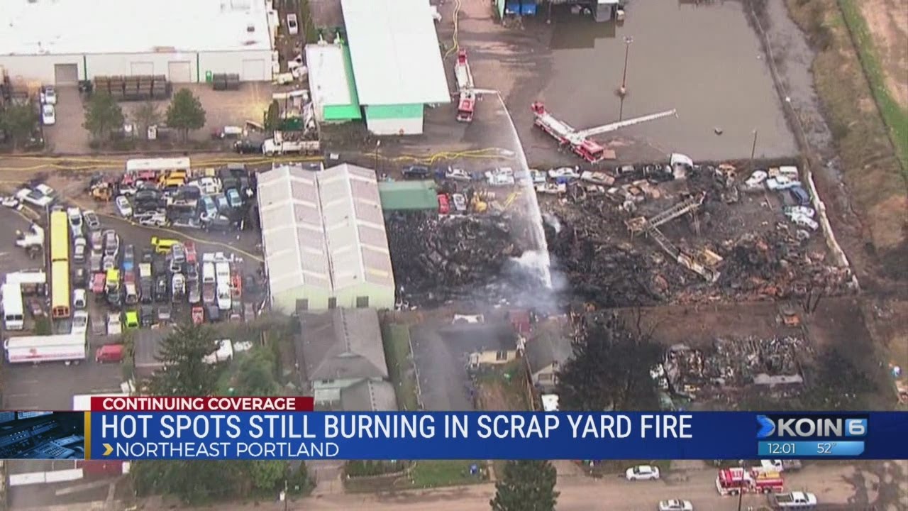 Hot spots still burning in scrap yard fire
