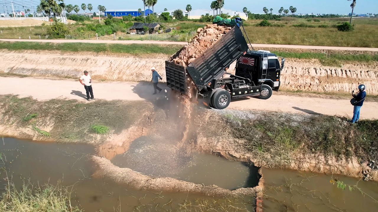 Start the first project using a D-31-p Dozer to push soil into the field and 5-ton dump truck