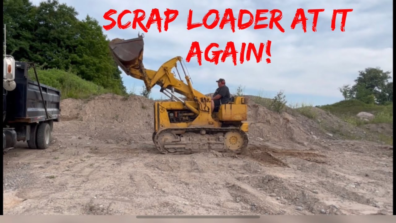 Working on and loading truck with international 125 crawler!