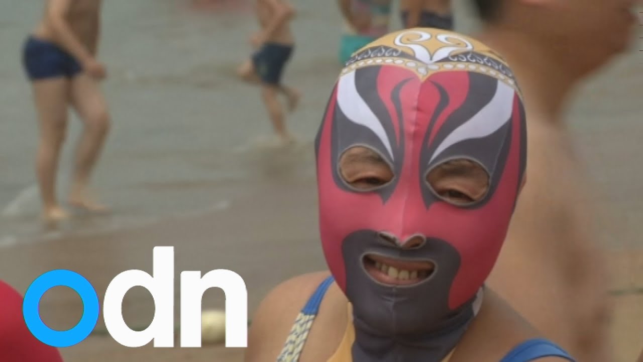 Women in China wear the Facekini in new beach trend