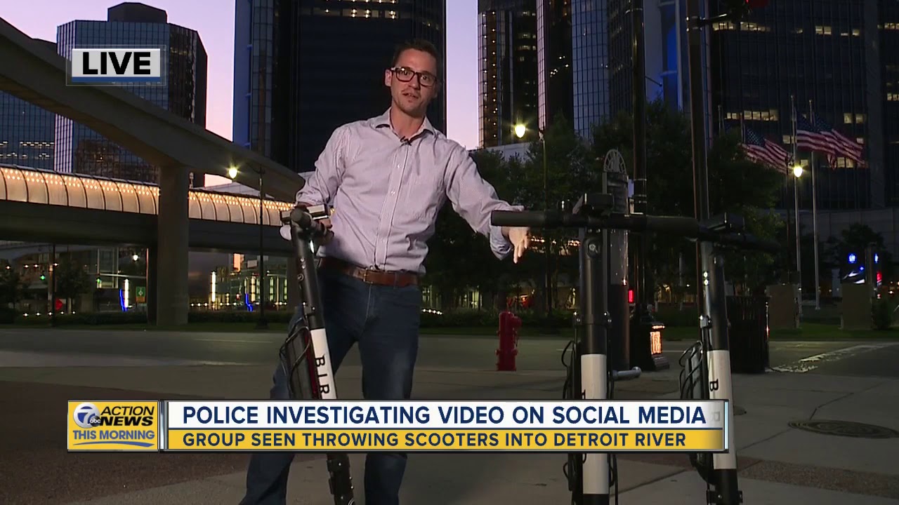 Viral video shows group throwing scooter into Detroit River