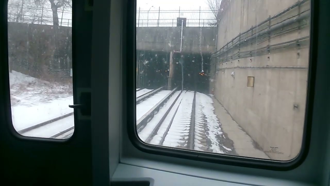 PATCO TRAINS ENTERING AND EXITING A TUNNEL IN CAMDEN AND A TRIP OVWE THE BEN FRANKLIN BRIDGE