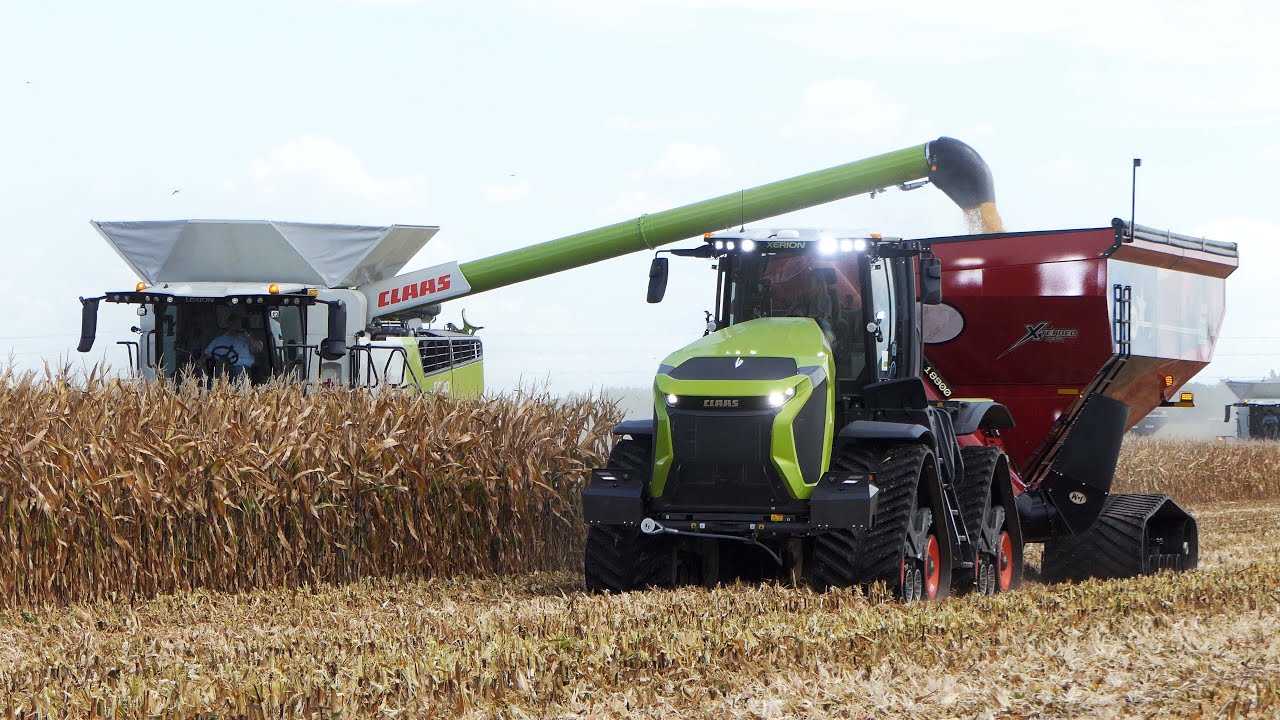 Different Combines & Tractors in the field Harvesting Corn