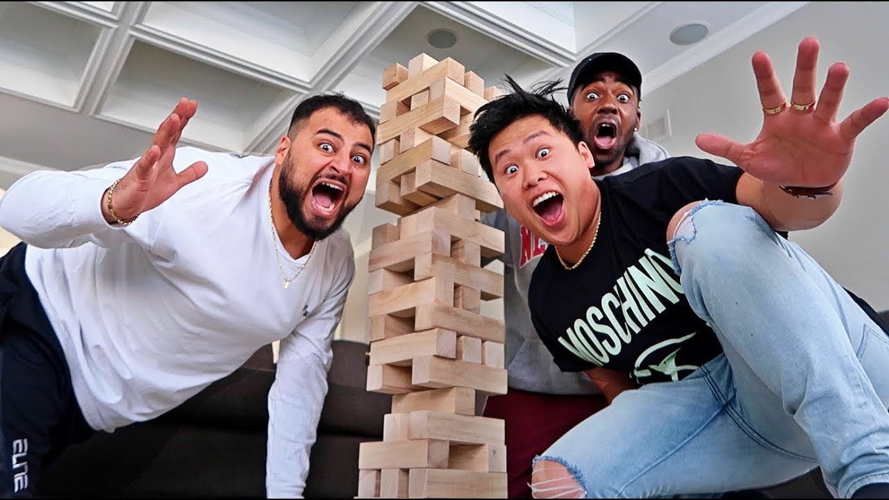 WORLD'S LARGEST GAME OF JENGA!!! (FIRST TO MAKE TOWER FALL DOWN LOSES)