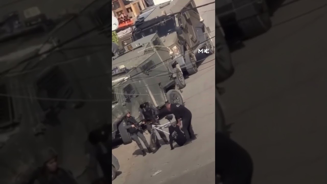 Israeli soldier pushes Palestinian cyclist off bicycle during Qalqilya raid
