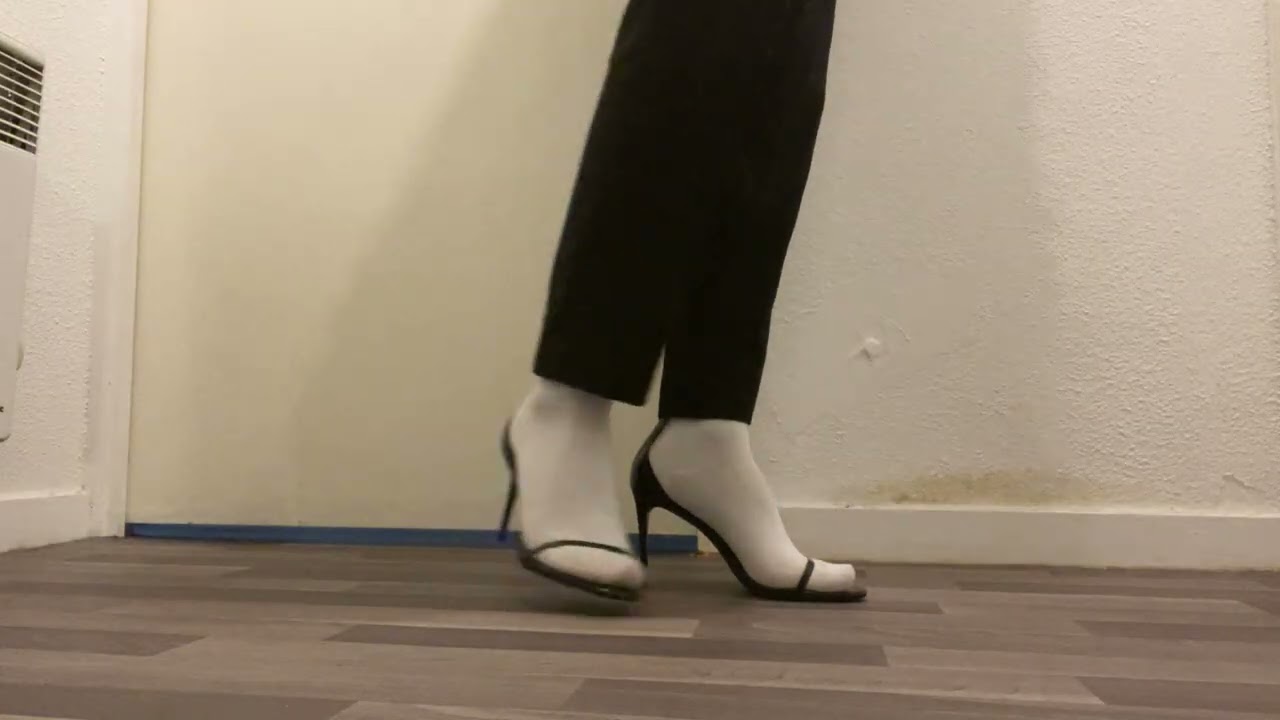 Boy trying high heels for the first time 