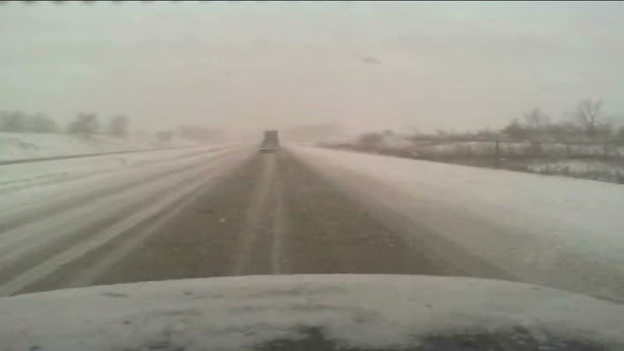 Cody Holyoke monitors slushy roads during Milwaukee snow.