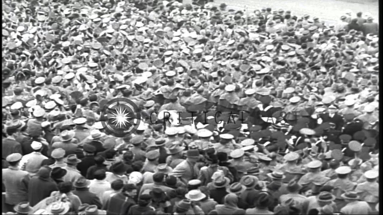 A large crowd gathers to watch a football match between the army and navy teams i...HD Stock Footage