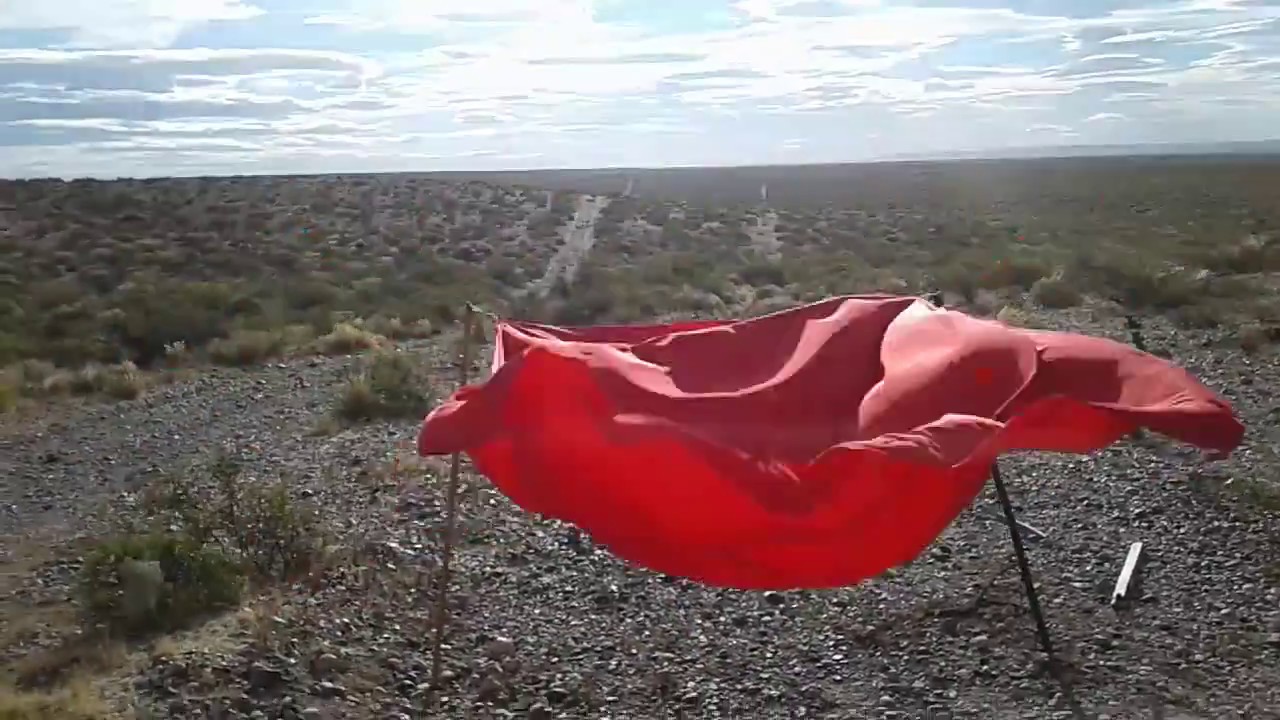 Red silk on strong windy day