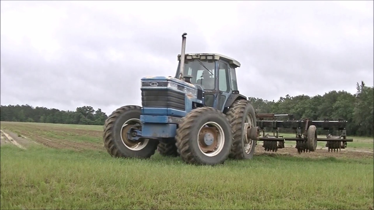 FORD 8830 WORKING BEDS AND JOHN DEERE 8235R PLANTING COTTON. DAVIS FARMS COTTON PLANTING 1