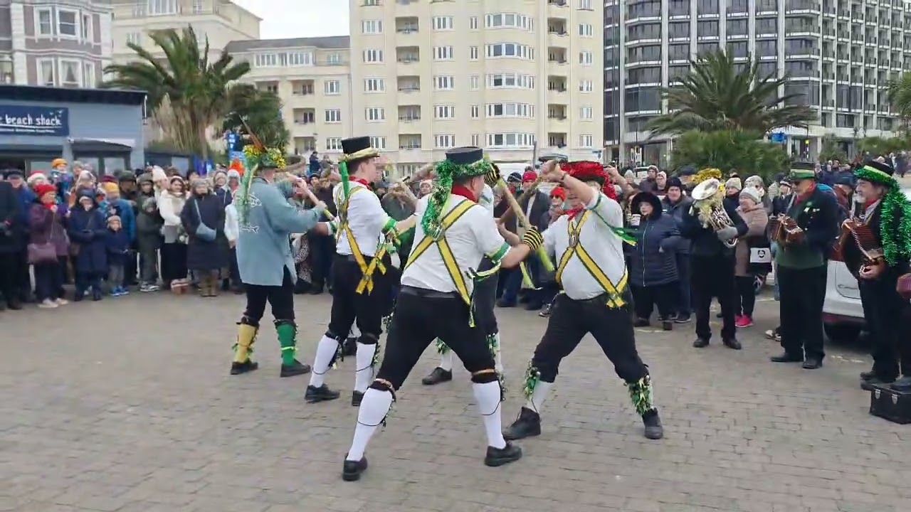 Long Man Morris dancing outside the Lifeboat Museum on Eastbourne Seafront