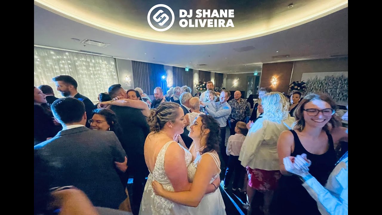 Guests join the couple on the dance floor for the first dance