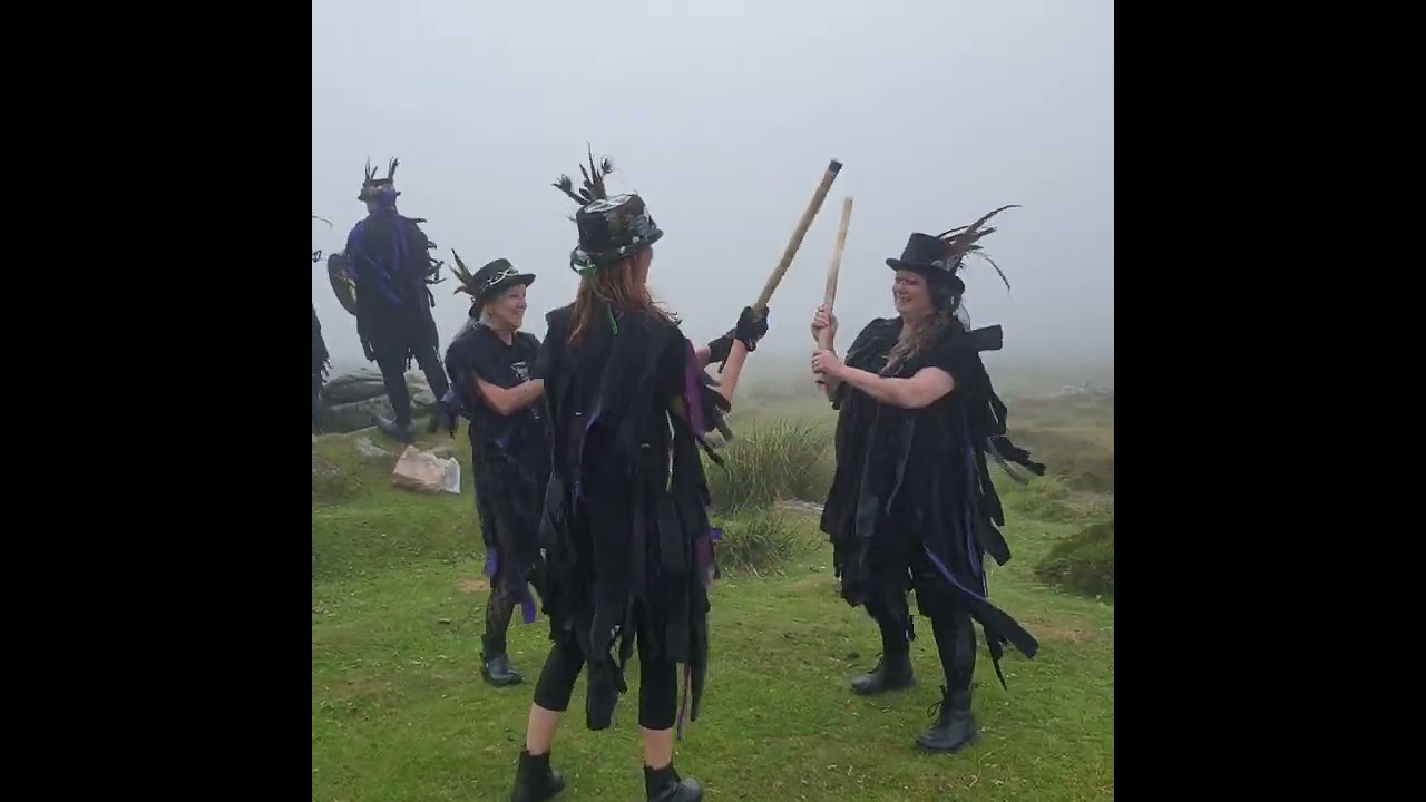 Kittys Cottee at Grimspound Settlement, Dartmoor, Devon, with Grimspound Border Morris