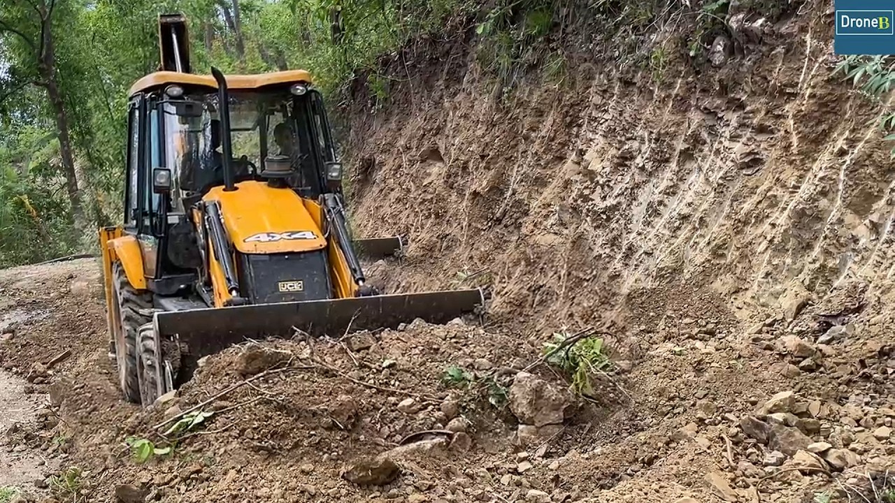 Widening and Smoothing Remote Village Road-Burying Water Supply Pipe