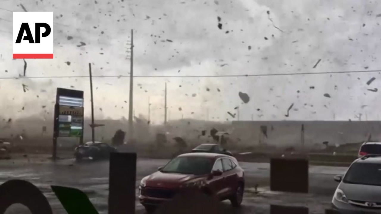 Debris goes flying as suspected tornado strikes Michigan