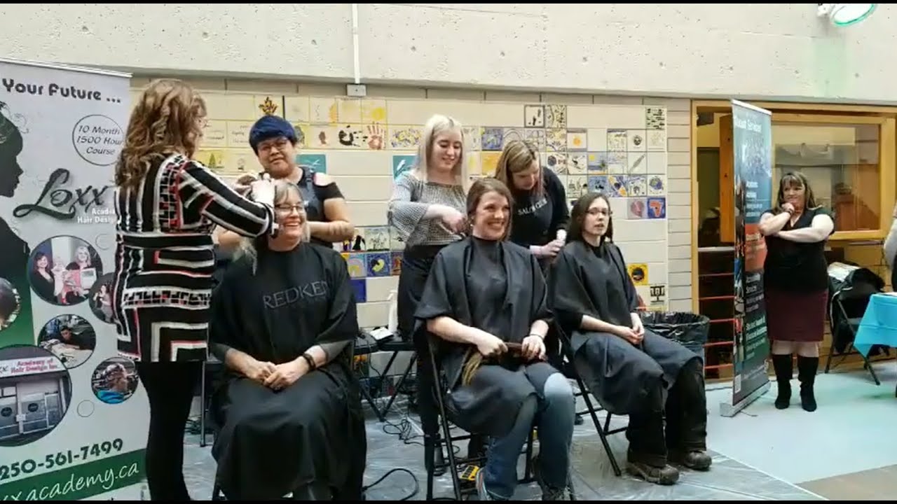 CHARITY BUZZCUTS - various women and men getting headshaves for charity