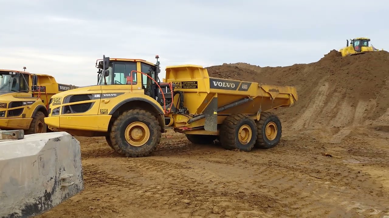 Volvo A30G Dump Truck tipping topsoil on heap in Essex