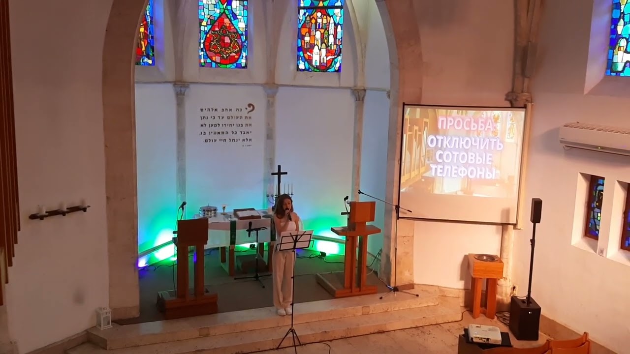 Singing girl from russian speaker's evangelical community service in Immanuel church Jaffa