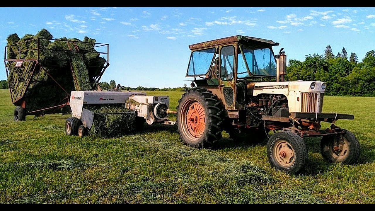 Raking Hay with 560 Farmall/ Baling Hay With a New Idea 551 Square Baler