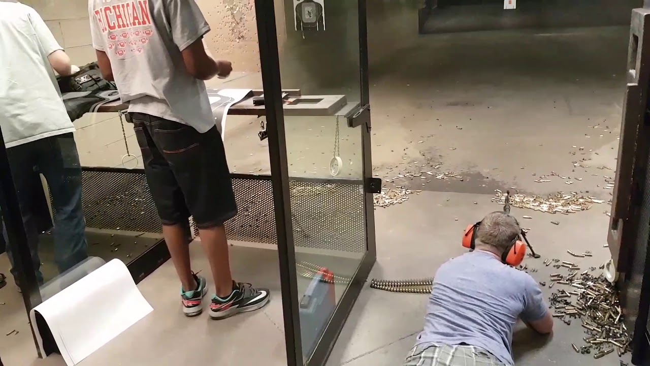 Firing a M60 machine gun - unloading a full belt