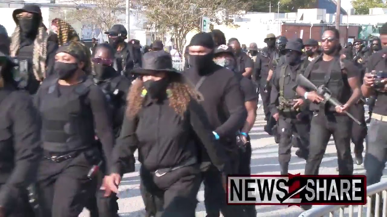 All black NFAC militia marches in the streets heavily armed!