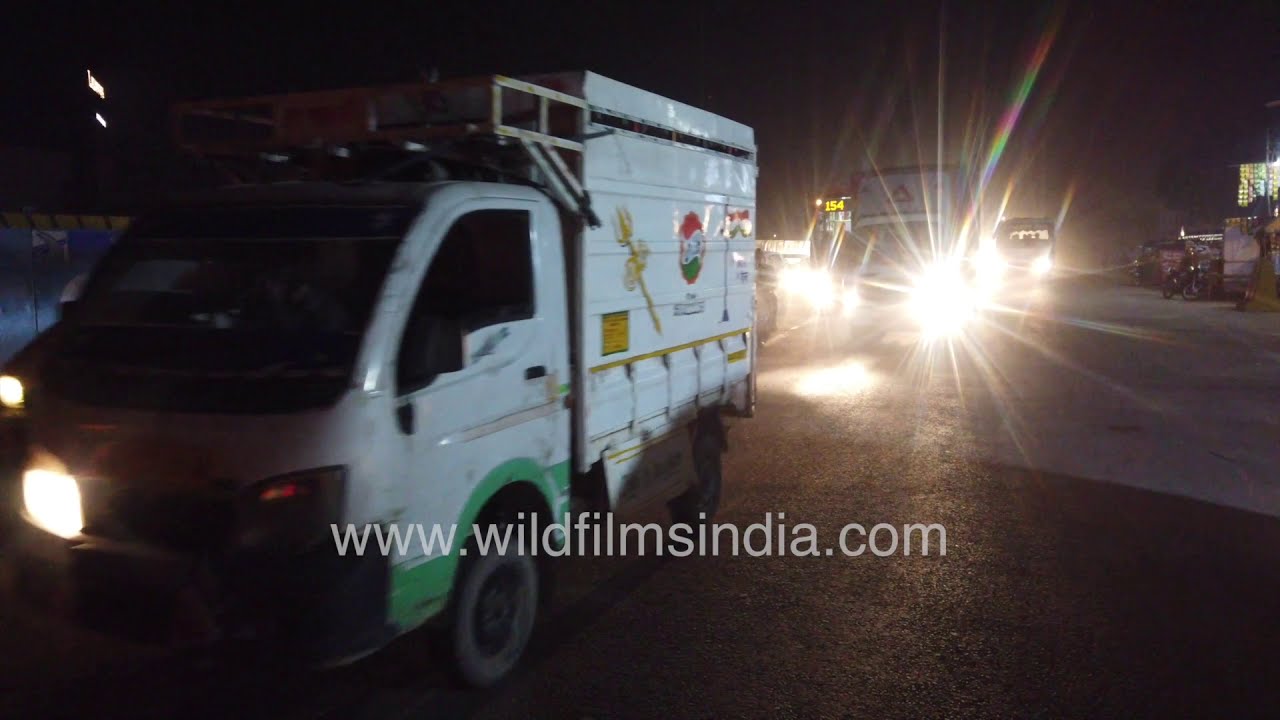 Delhi traffic at night during Corona Pandemic - Steady stream of vehicles with loud honking