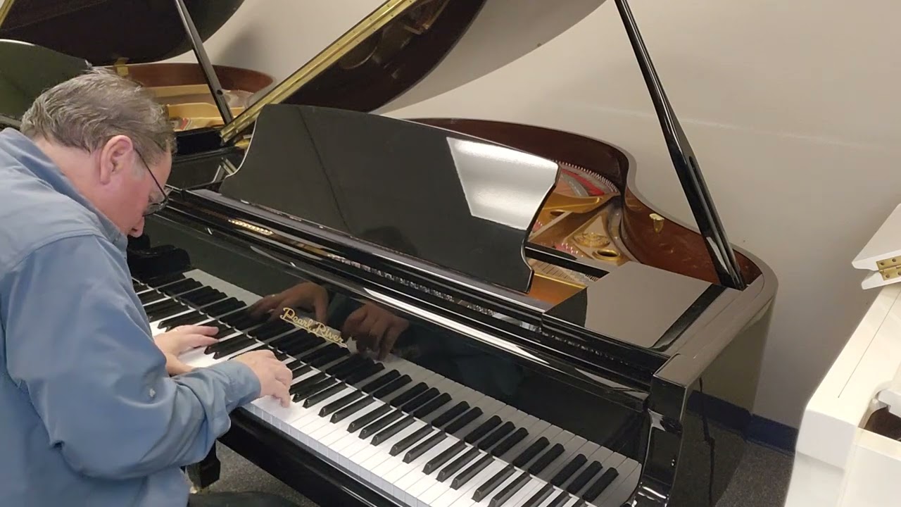 Nearly-new Ebony Baby Grand on sale