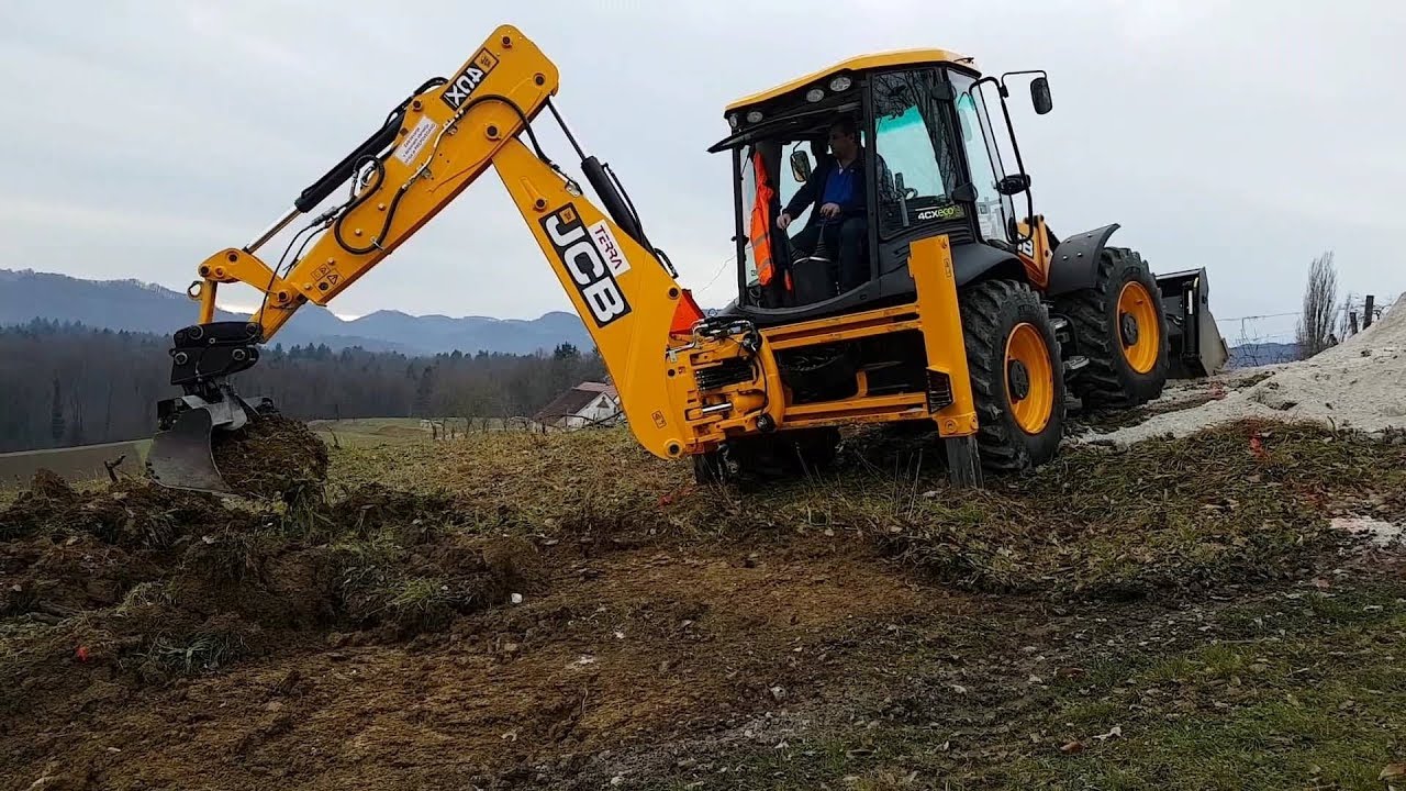 JCB 4cx backhoe loader making a road on a hill