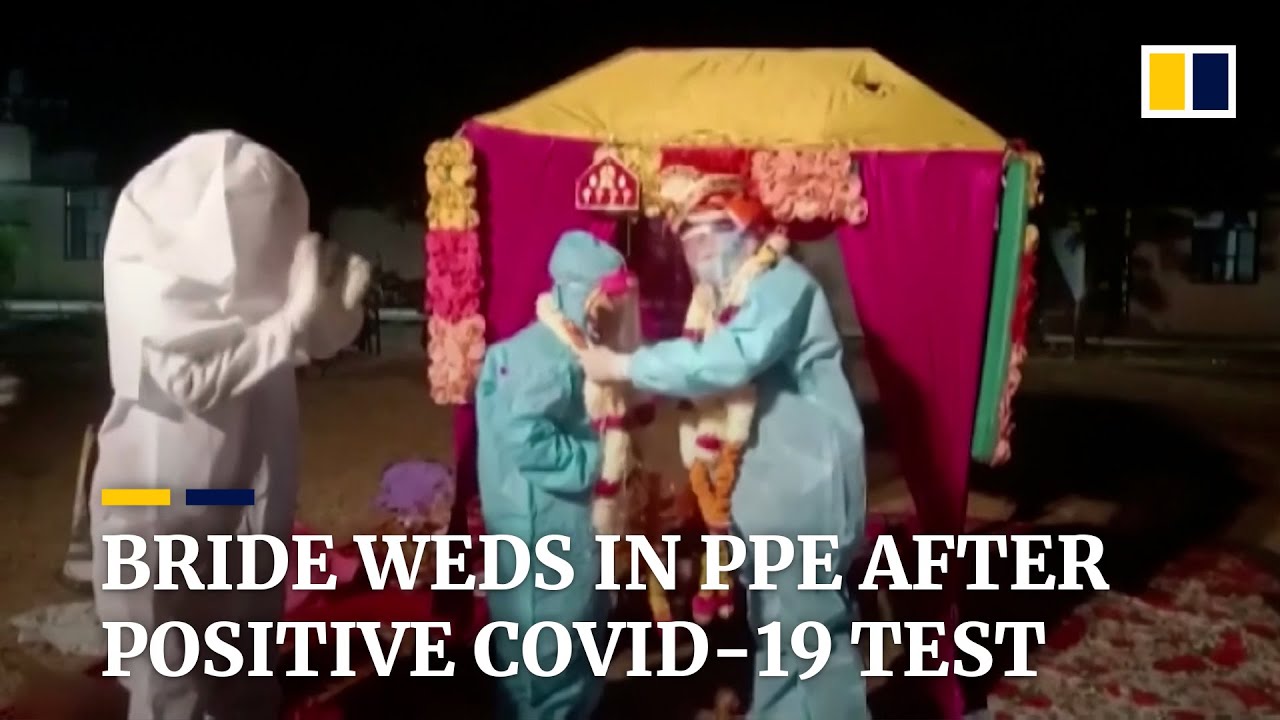 Indian bride ties the knot in protective suit after testing positive for coronavirus on wedding day