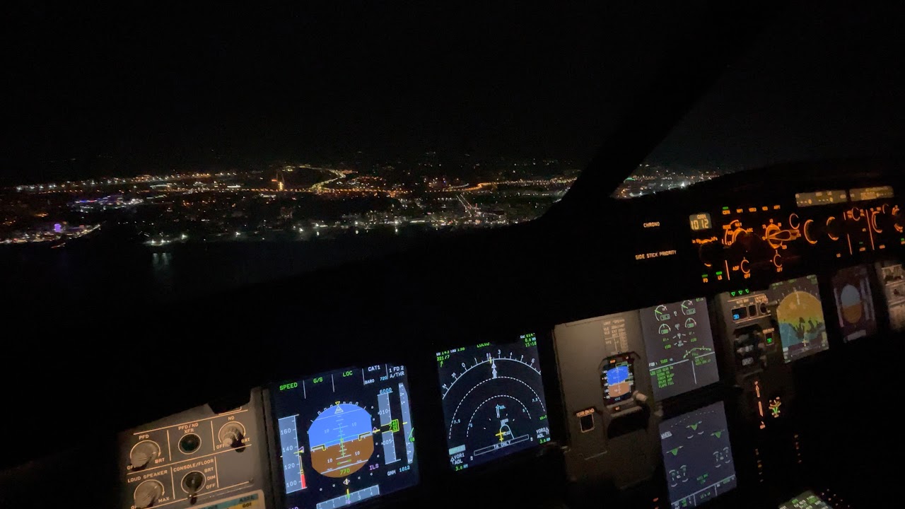 Airbus A321 night landing. Cockpit view , manual flight