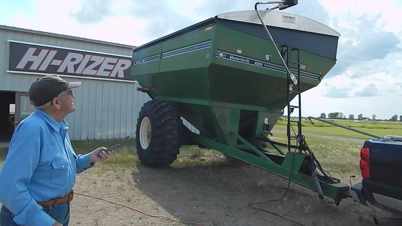 Electric Roll Tarp With Remote On A Grain Cart