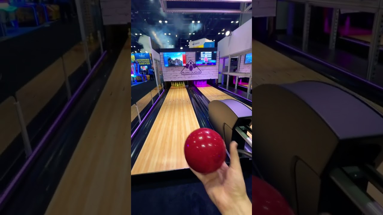 Rolling a strike in Duckpin Bowling at IAAPA 2022