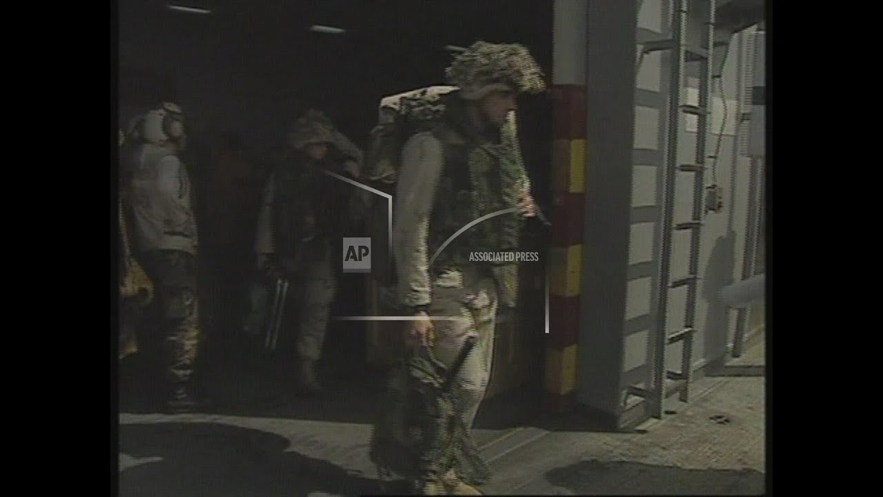 Marines board helicopters on USS Peleliu + ops on USS Vinson