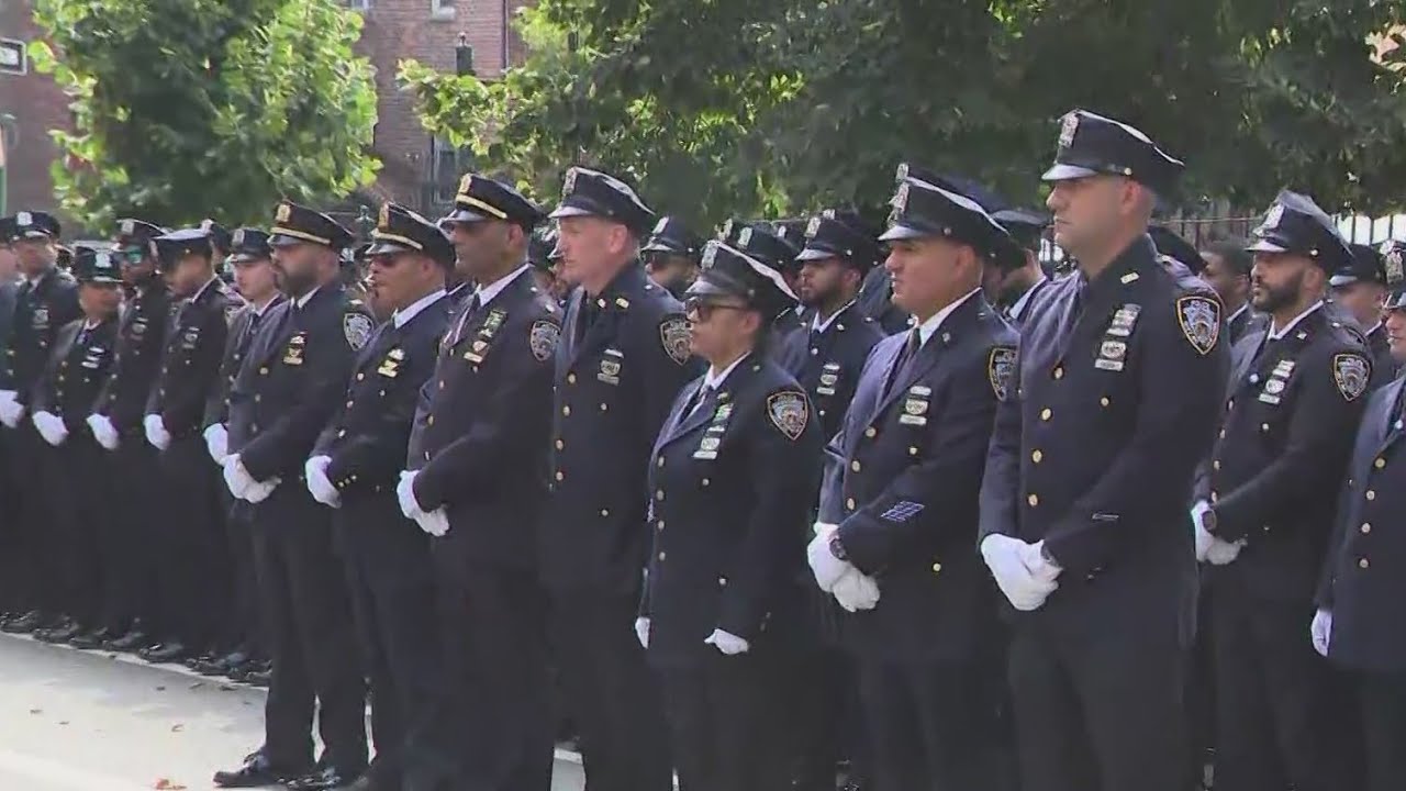 Hero cop promoted to detective at funeral attended by thousands
